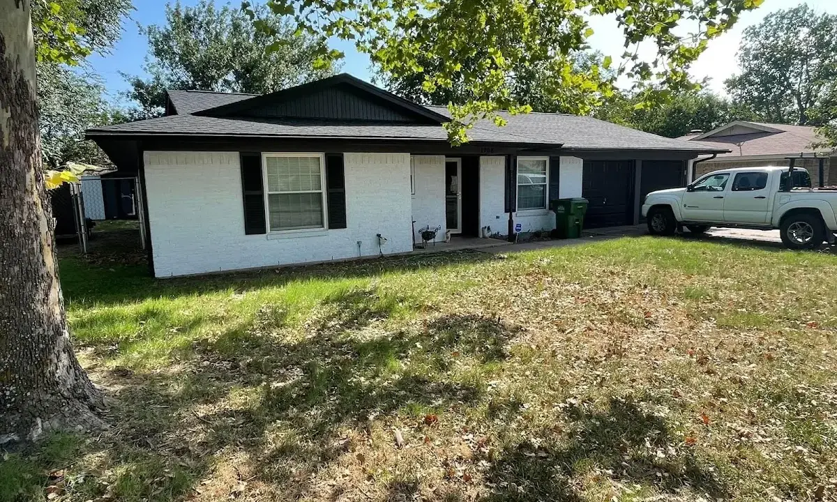 Professional roofing crew working on a residential roof in Tolleson
